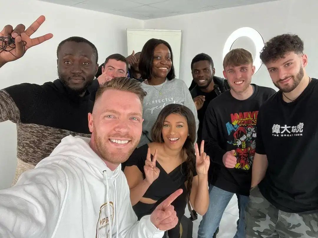 The two of us in a selfie with the cast of a shoot, everyone smiling
